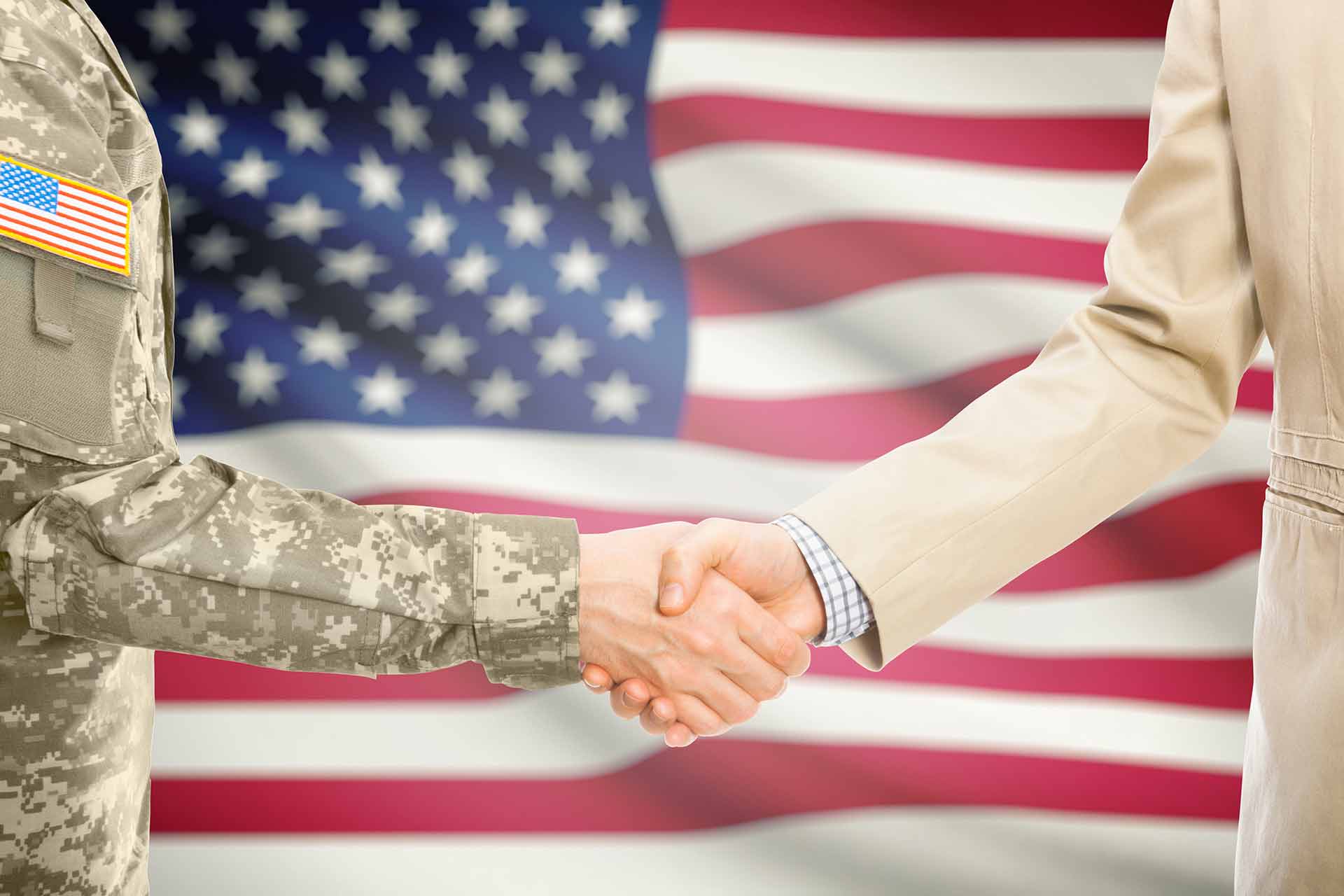 Image of veteran and business owner shaking hands